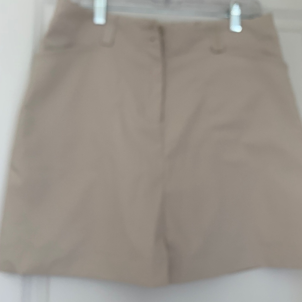 Beige Nike Golf Skort, 4 pockets, size 10